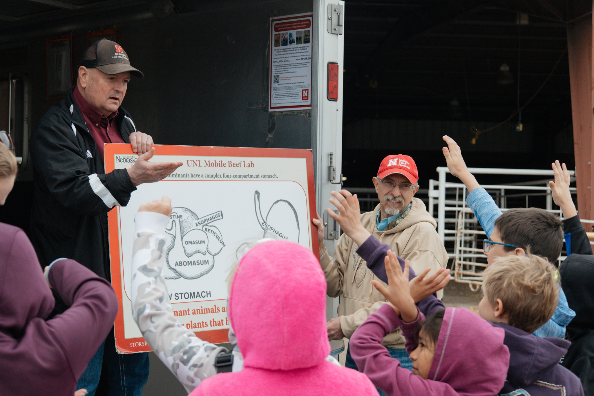 Extension educator teaches youth at a mobile beef lab event