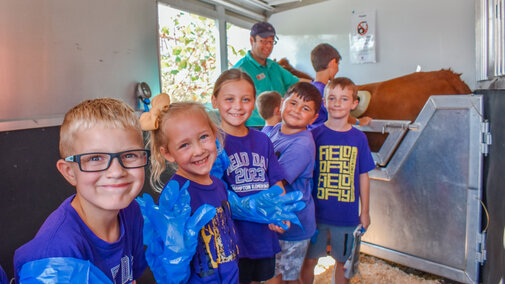 Elementary students waiting in line for the Husker Beef Lab. 